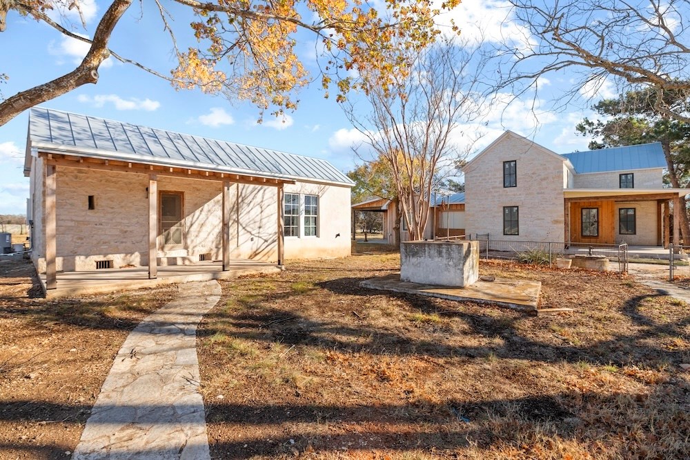 1410 Grapetown Road Fredericksburg, TX 78624 - Photo 35 of 60 a view of a house with a yard