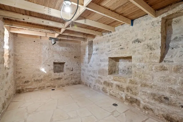 a view of yard covered with snow in front of house