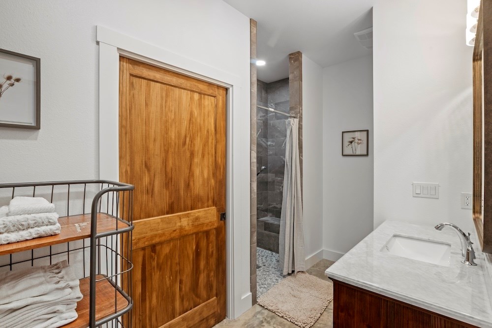 1410 Grapetown Road Fredericksburg, TX 78624 - Photo 46 of 60 a bathroom with a sink and a mirror
