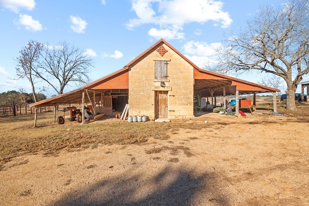 1410 Grapetown Road Fredericksburg, TX 78624 - Photo 49 of 60 a view of a house with snow on the road
