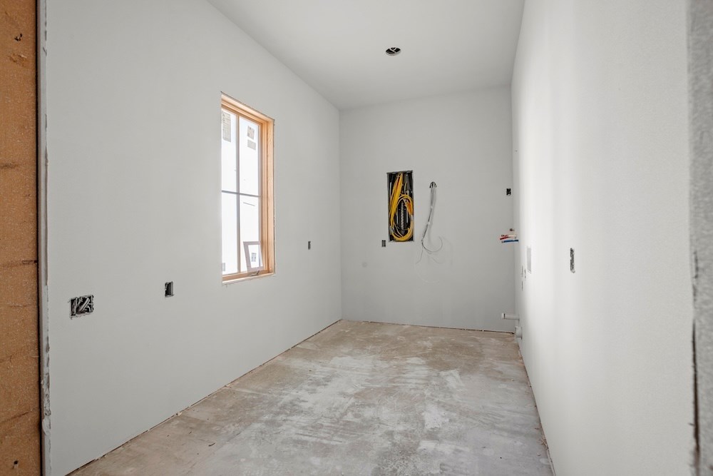 1410 Grapetown Road Fredericksburg, TX 78624 - Photo 9 of 60 a view of an empty room with a window