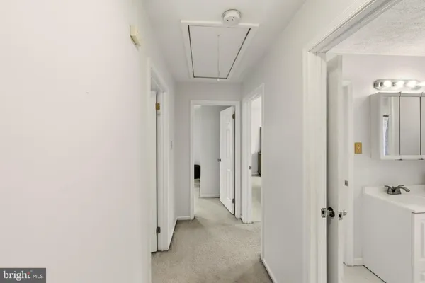 a view of a hallway with closet