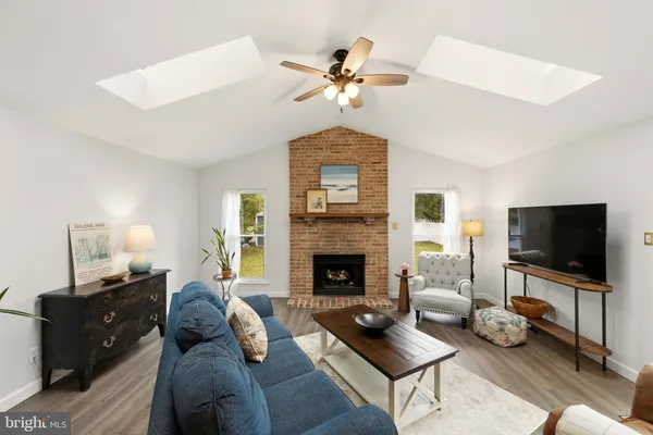 a living room with furniture fireplace and a flat screen tv