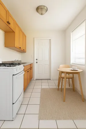 a kitchen with a table chairs and a stove top oven