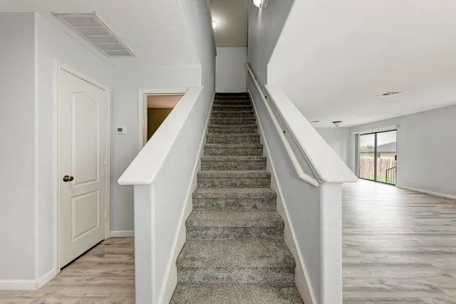 a view of an empty room with a window