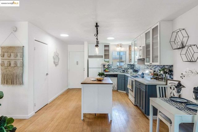 a kitchen with a table and chairs