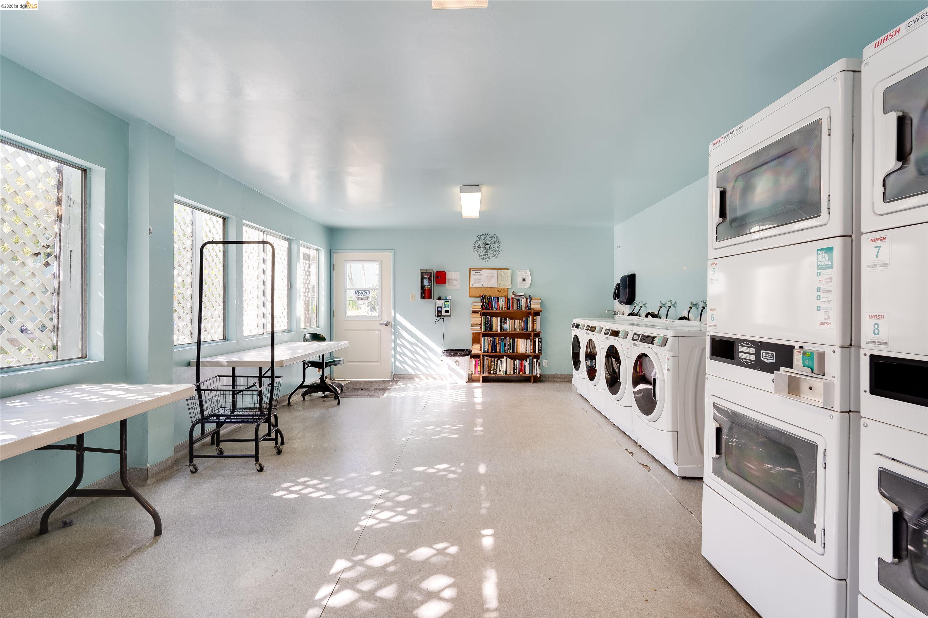 325 Kitty Hawk Road, Unit 207 Alameda, CA 94501 - Photo 24 of 43 a view of a livingroom with furniture and windows