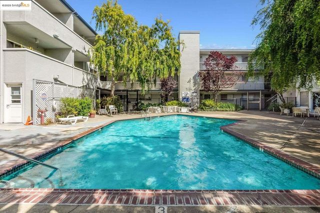a view of parking space with cars parked