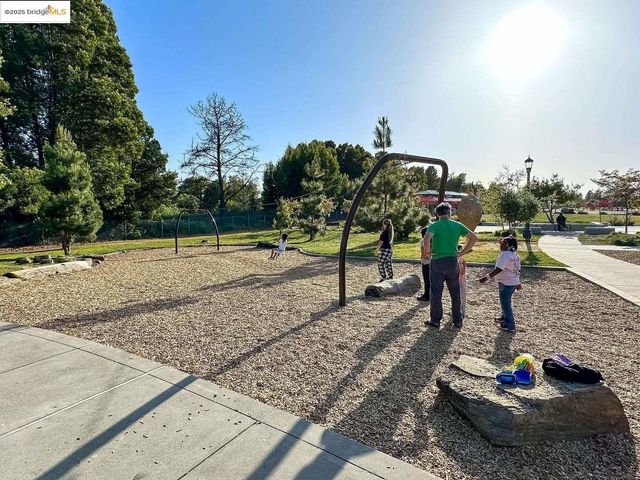 a living room with furniture a dining table and chairs