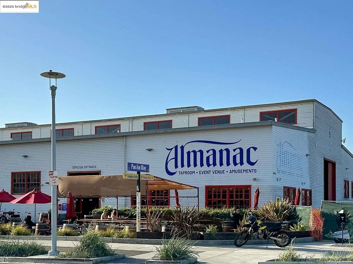 325 Kitty Hawk Road, Unit 207 Alameda, CA 94501 - Photo 42 of 43 a view of street with an entrance and retail shops