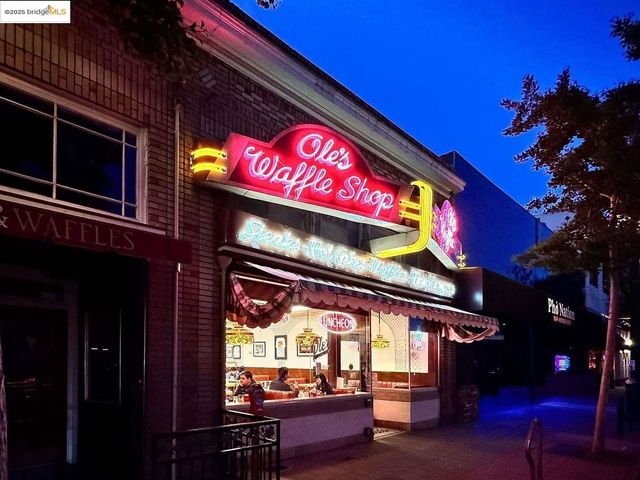 a view of a street with benches in the background