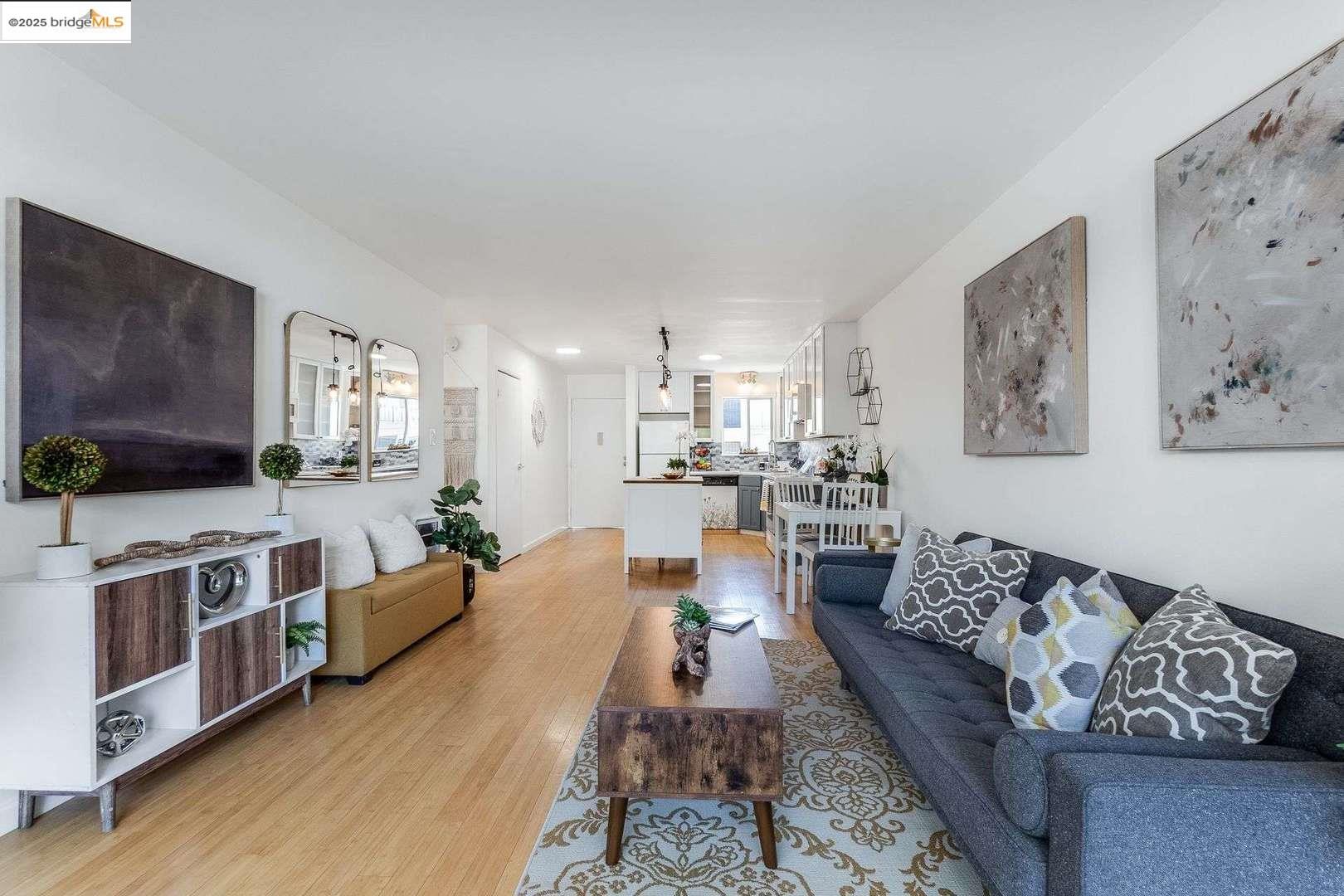 325 Kitty Hawk Road, Unit 207 Alameda, CA 94501 - Photo 9 of 43 a large living room with stainless steel appliances furniture and a kitchen