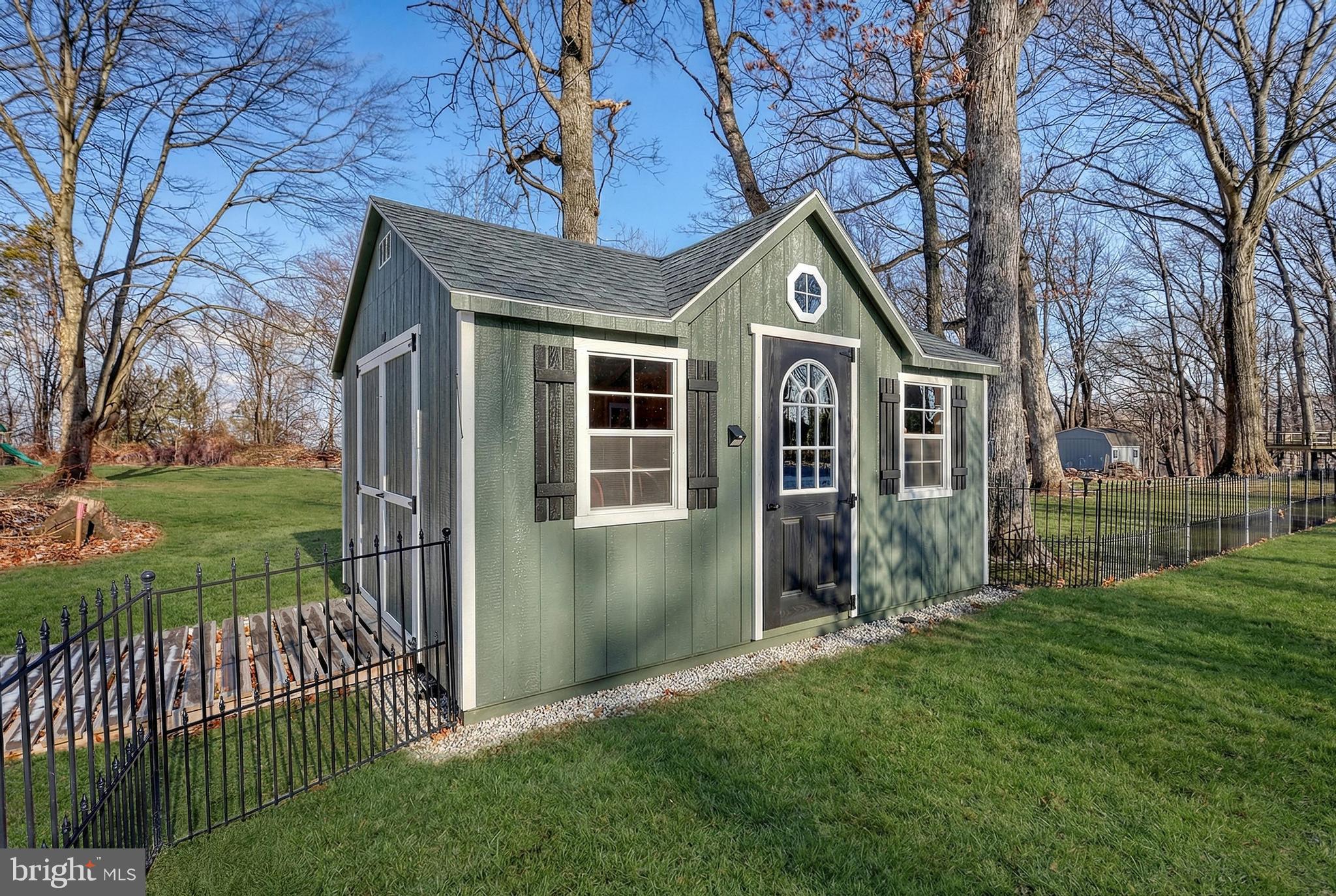809 Flintlock Ridge Road Mechanicsburg, PA 17055 - Photo 13 of 20 a front view of a house with garden