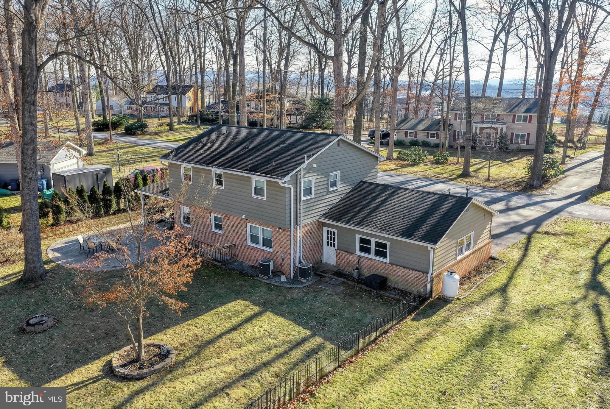 809 Flintlock Ridge Road Mechanicsburg, PA 17055 - Photo 14 of 20 a view of a house with backyard and sitting area