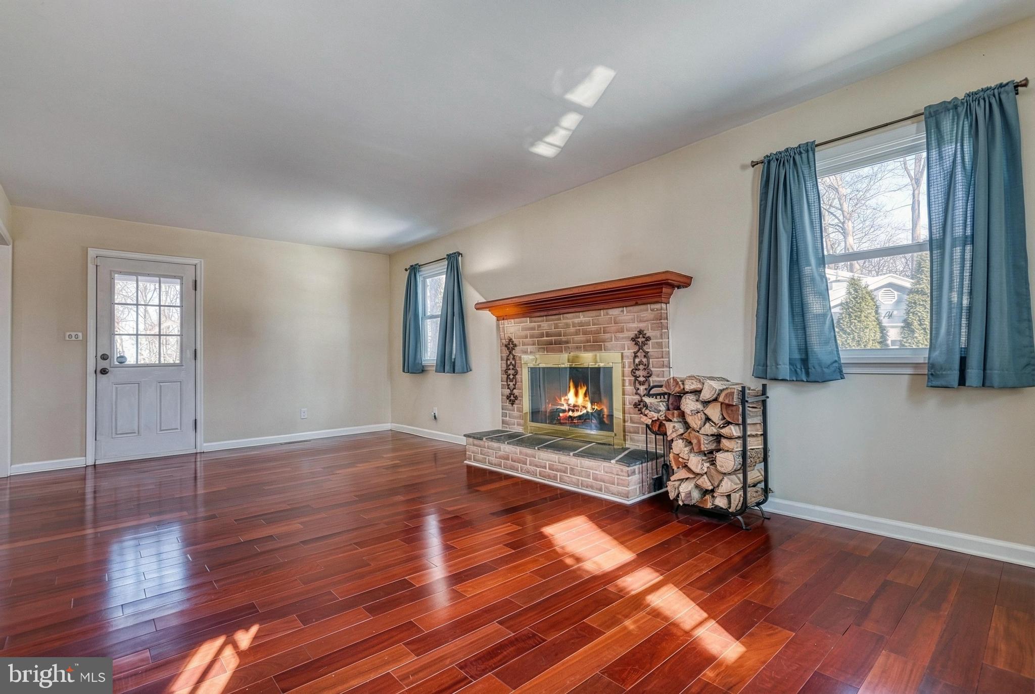 809 Flintlock Ridge Road Mechanicsburg, PA 17055 - Photo 15 of 46 a living room with furniture and a fireplace