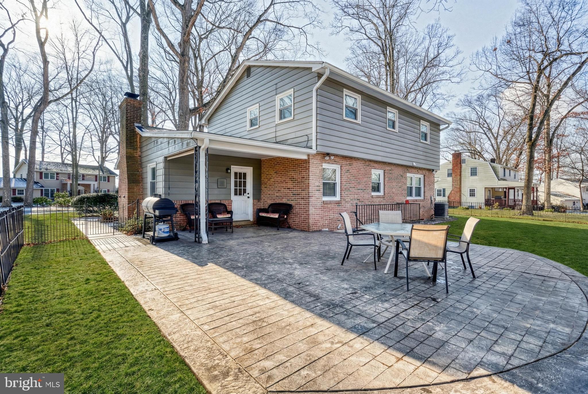 809 Flintlock Ridge Road Mechanicsburg, PA 17055 - Photo 16 of 46 a view of a house with backyard porch and sitting area
