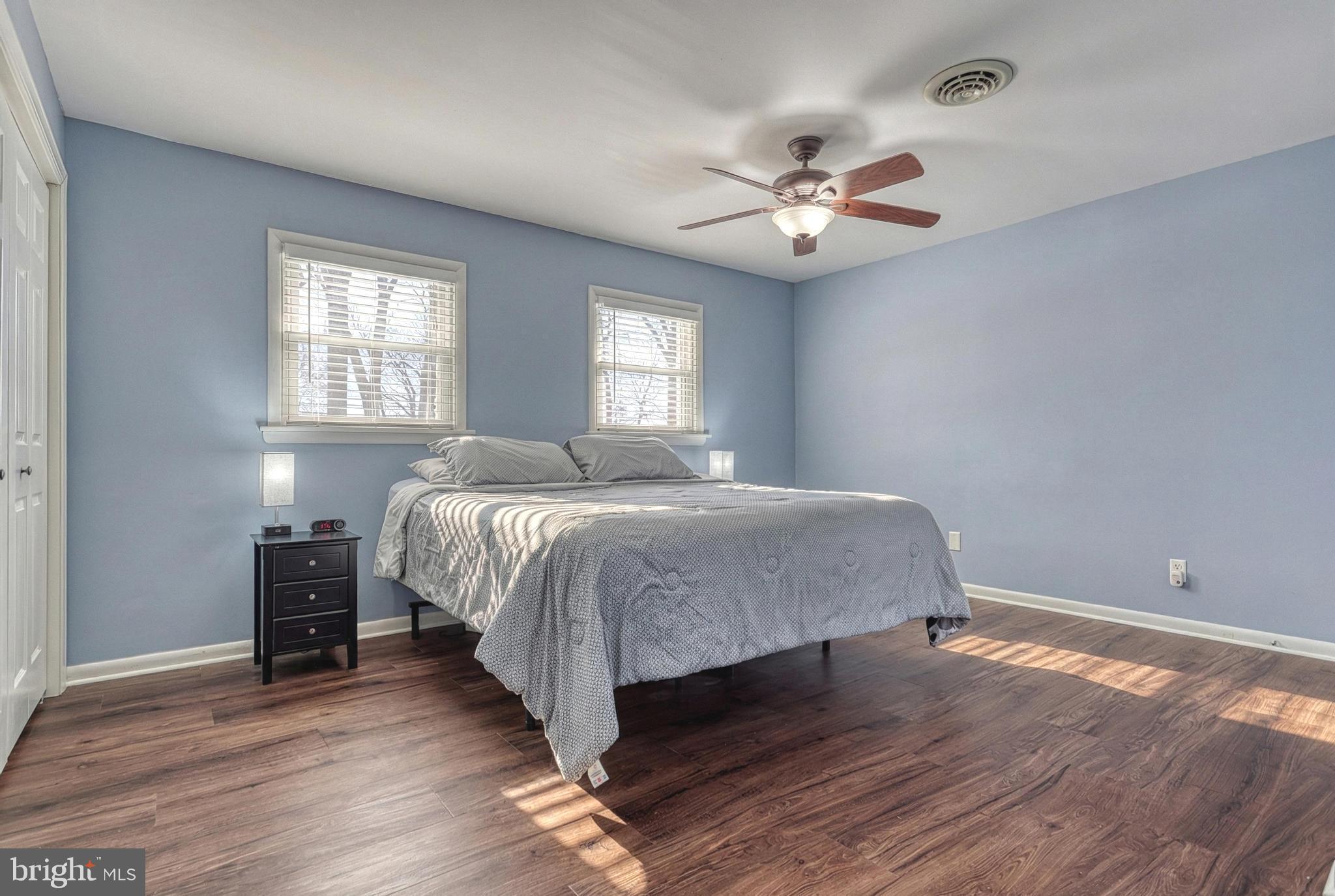 809 Flintlock Ridge Road Mechanicsburg, PA 17055 - Photo 20 of 46 a bedroom with a bed and a chandelier
