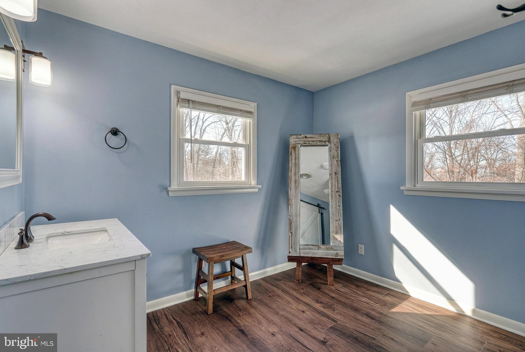 809 Flintlock Ridge Road Mechanicsburg, PA 17055 - Photo 24 of 46 a view of a room that has a window and wooden floor