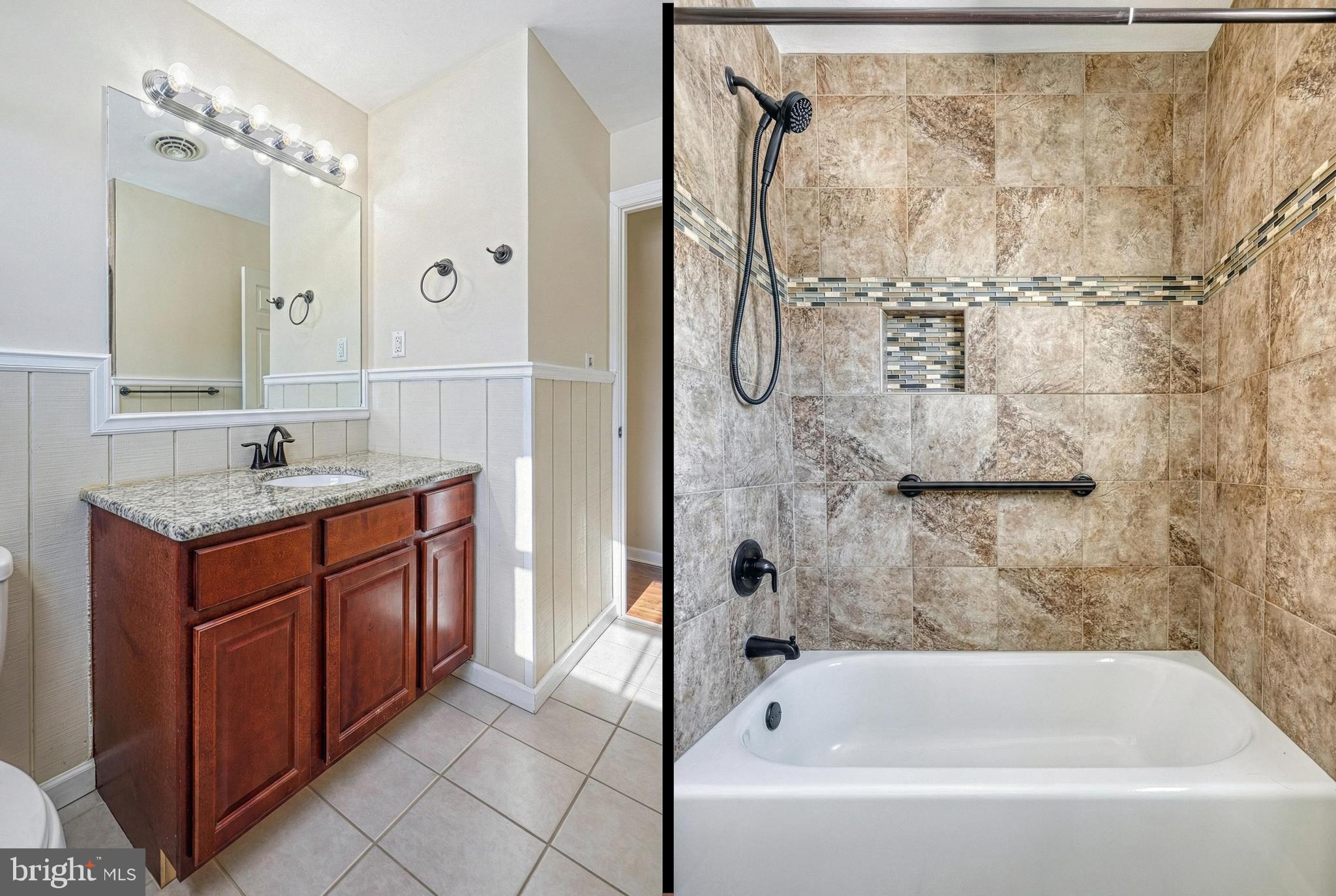 809 Flintlock Ridge Road Mechanicsburg, PA 17055 - Photo 28 of 46 a bathroom with a granite countertop sink a mirror and a bathtub
