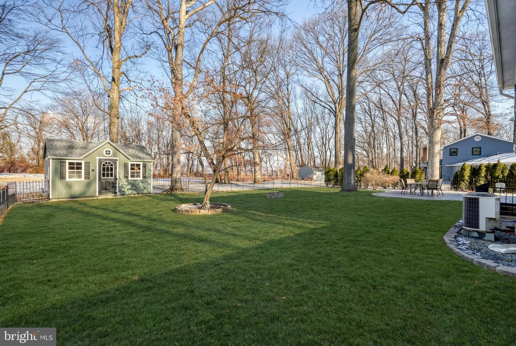 809 Flintlock Ridge Road Mechanicsburg, PA 17055 - Photo 40 of 46 a view of a house with a yard
