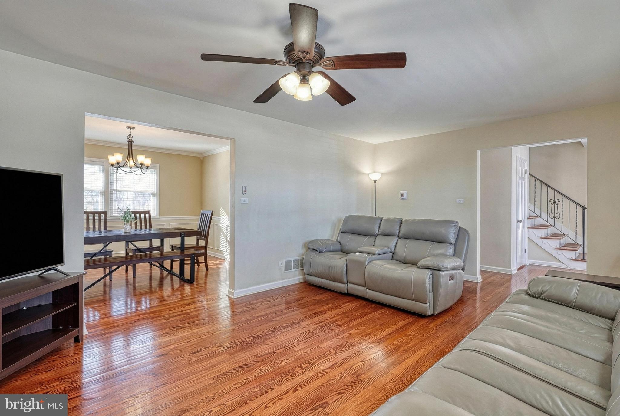 809 Flintlock Ridge Road Mechanicsburg, PA 17055 - Photo 4 of 46 a living room with furniture and a flat screen tv