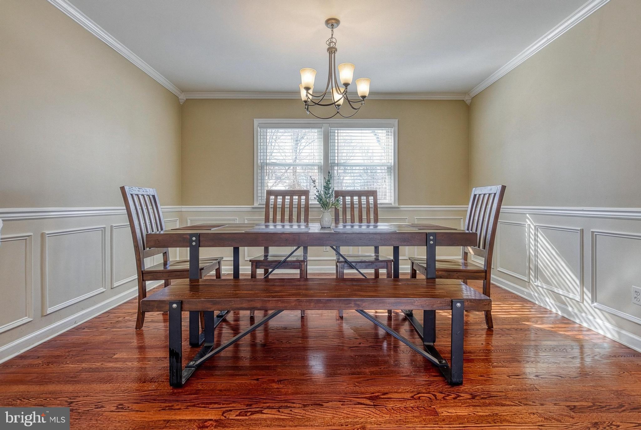 809 Flintlock Ridge Road Mechanicsburg, PA 17055 - Photo 5 of 46 a view of a dining room with furniture window and wooden floor