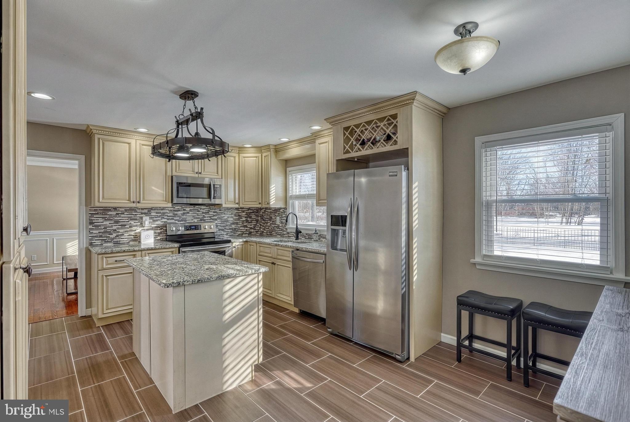 809 Flintlock Ridge Road Mechanicsburg, PA 17055 - Photo 7 of 46 a kitchen with stainless steel appliances a sink stove and refrigerator