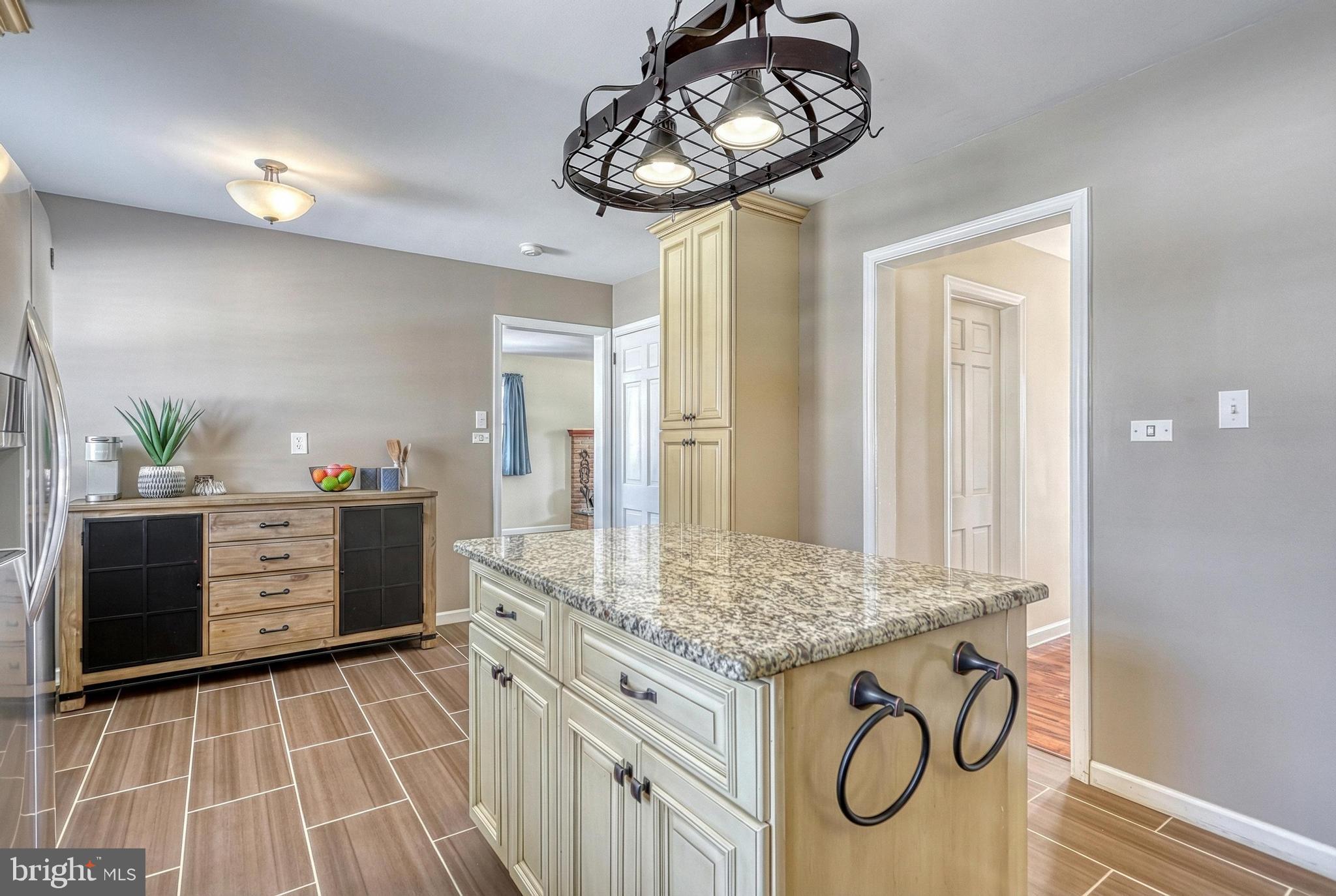 809 Flintlock Ridge Road Mechanicsburg, PA 17055 - Photo 10 of 46 a kitchen with stainless steel appliances a stove and cabinets