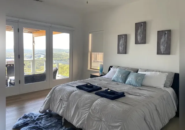 a living room with furniture a fireplace and a potted plant
