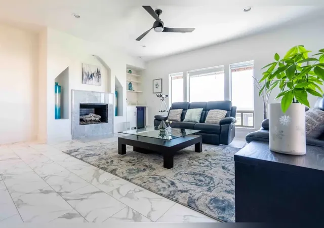 a bedroom with a large bed and a large window