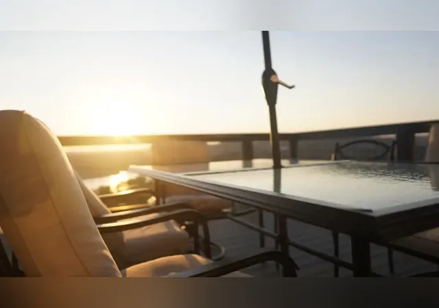 a view of a balcony with ocean view