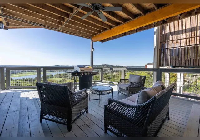 a view of a balcony with chairs