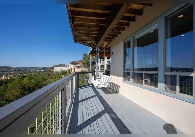 a view of a balcony with wooden floor