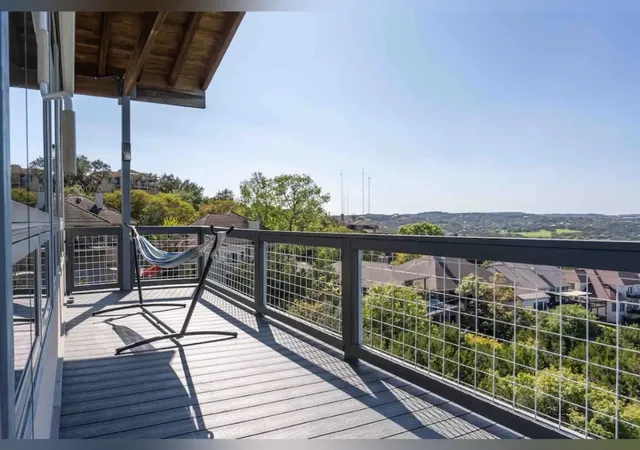 a dining room with furniture a chandelier and wooden floor