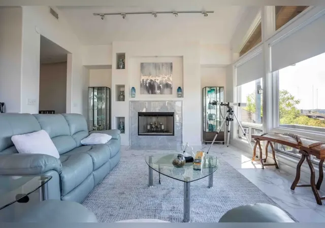 a kitchen with stainless steel appliances a stove refrigerator and cabinets