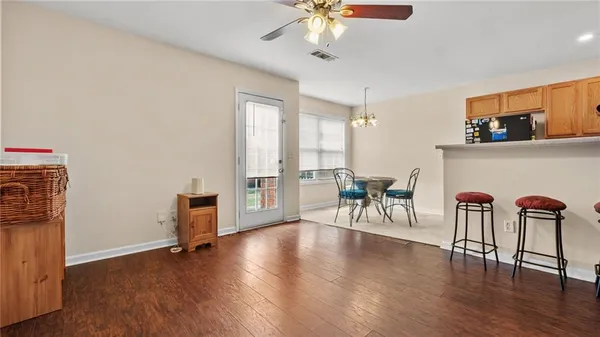 a view of a livingroom with furniture and a window