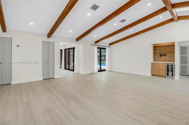 a utility room with window and washer