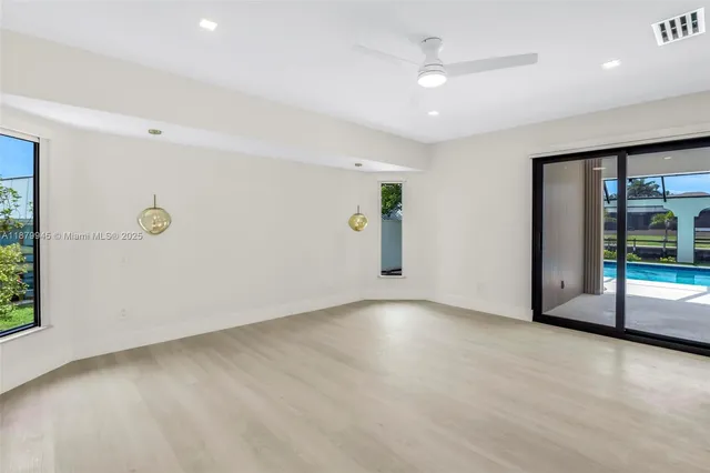 a view of a swimming pool with a porch