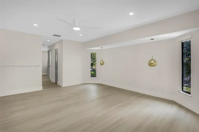 a view of swimming pool with a patio