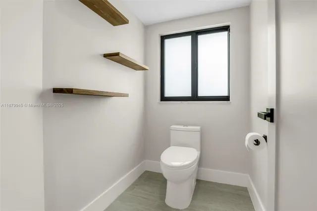 a view of a lake with houses in the back