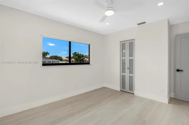 an aerial view of residential houses with outdoor space and river