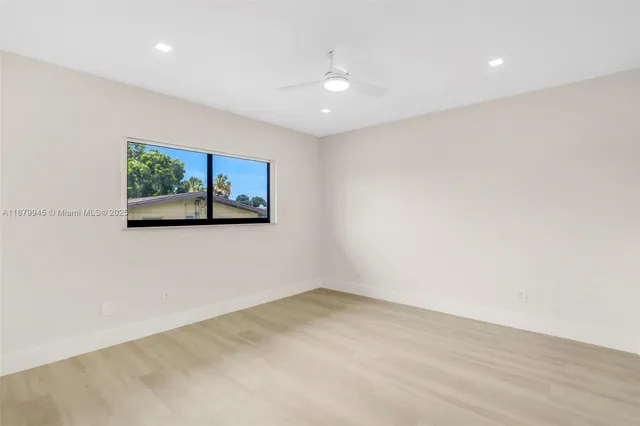 an aerial view of a house with a garden