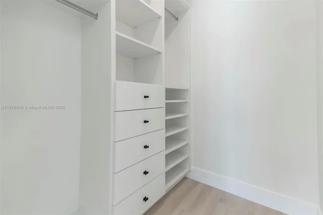 a view of a lake with houses in the back