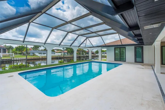 a front view of house with a garden