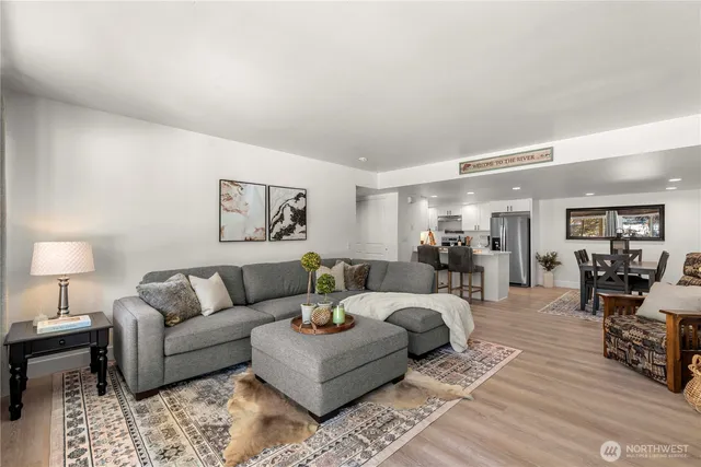 a living room with furniture and a lamp