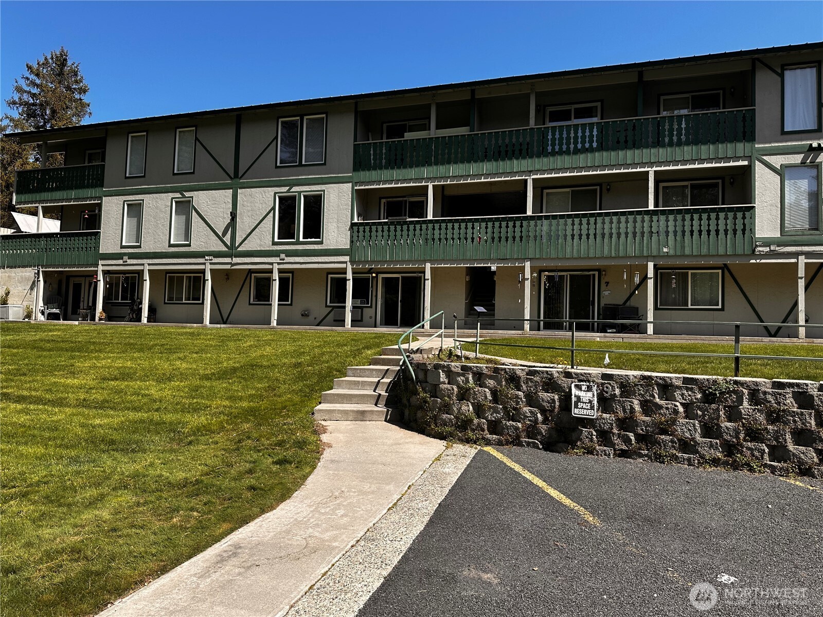 8348 Main Street, Unit 6 Peshastin, WA 98847 - Photo 2 of 34 a front view of a house with a yard
