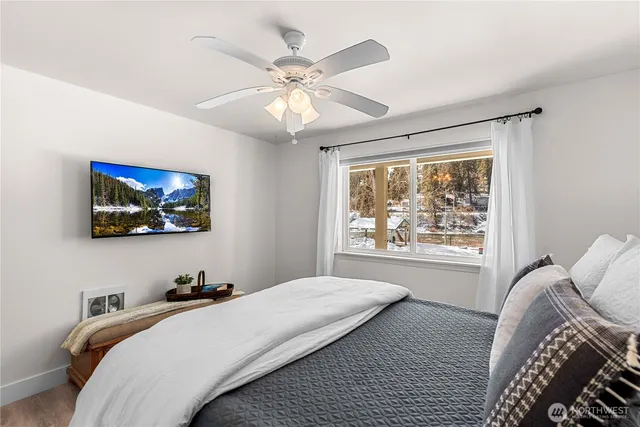 a bedroom with a large bed and a window