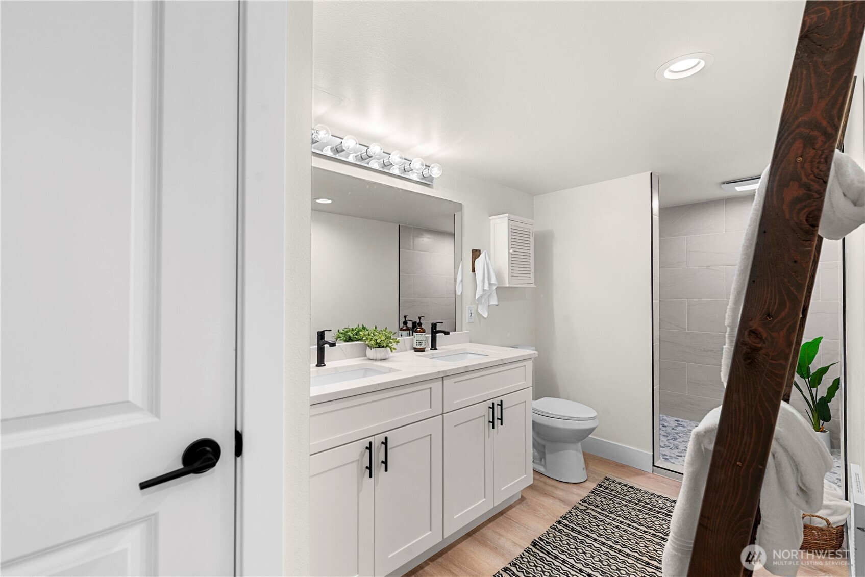 8348 Main Street, Unit 6 Peshastin, WA 98847 - Photo 26 of 34 a bathroom with a sink a toilet a mirror and shower