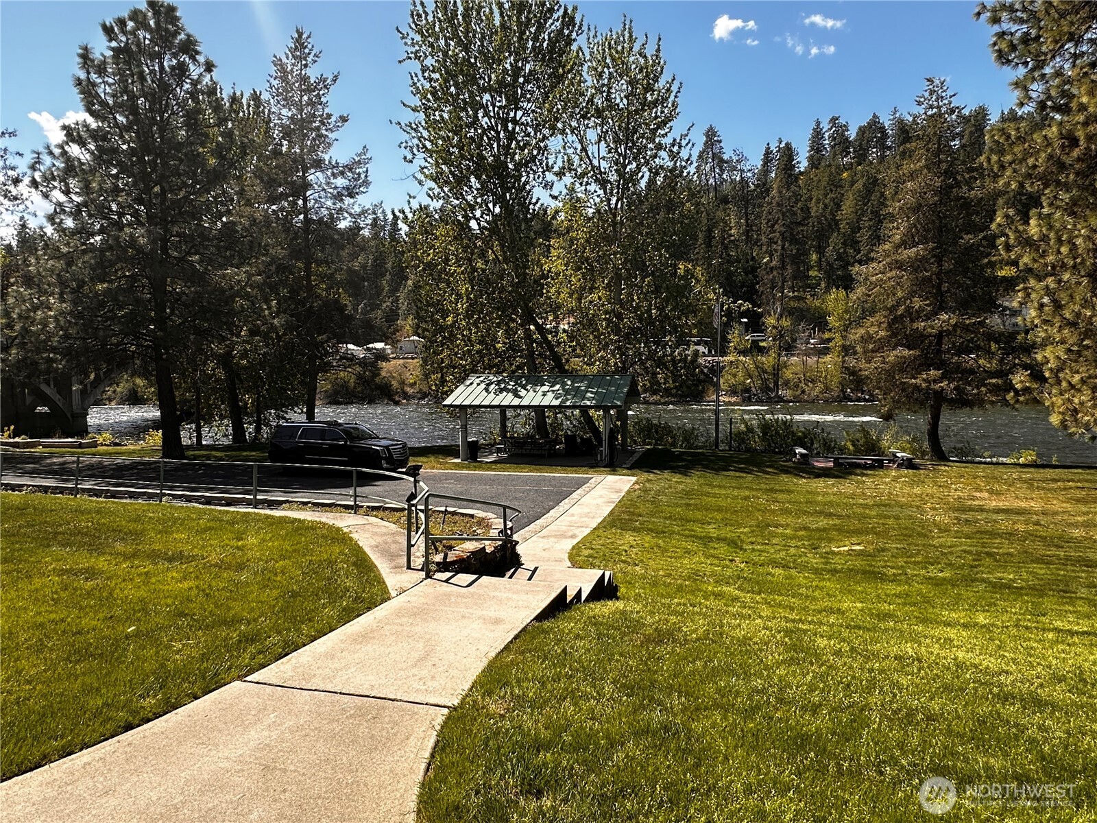 8348 Main Street, Unit 6 Peshastin, WA 98847 - Photo 4 of 34 a view of swimming pool with outdoor seating and trees
