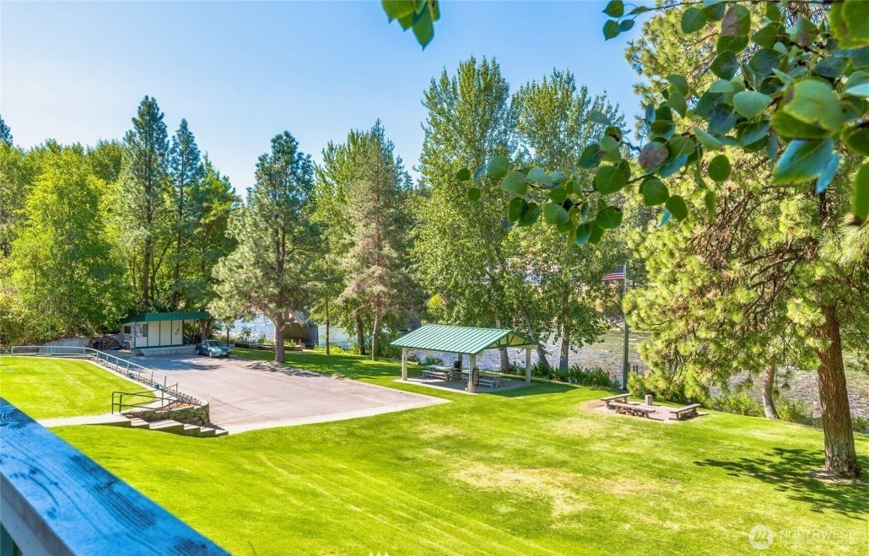 8348 Main Street, Unit 6 Peshastin, WA 98847 - Photo 7 of 34 a view of a swimming pool with an outdoor seating and a yard